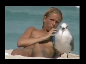 Flatchest Beauty Not Alone on Beach