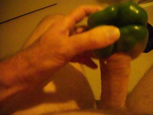 Masturbating with a vegetable