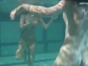 Naked chicks have some fun underwater